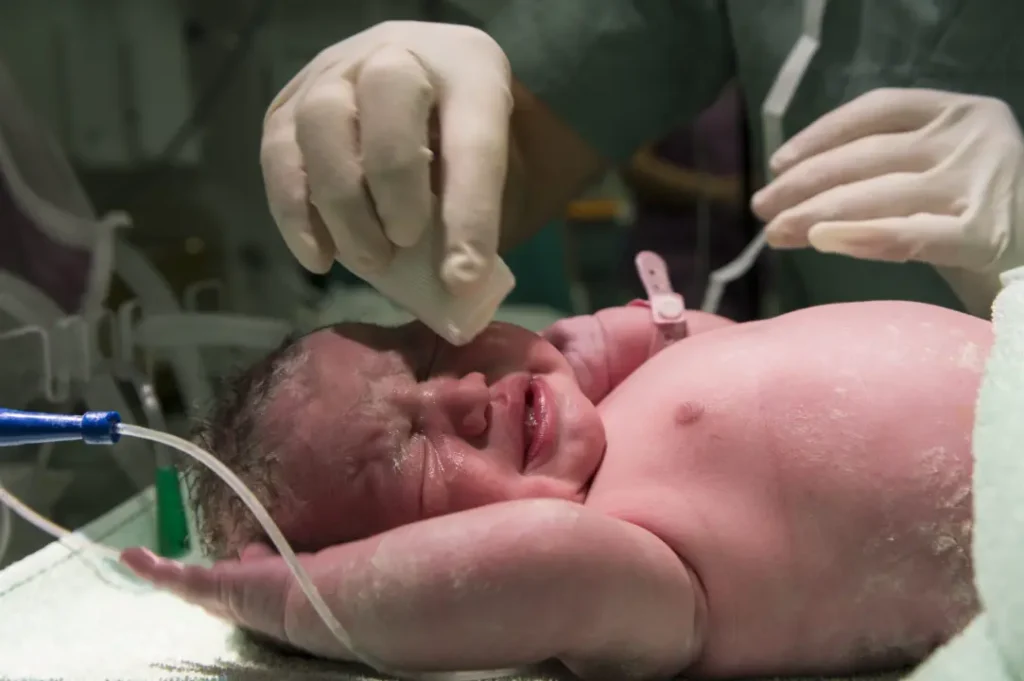 close up newborn baby crying