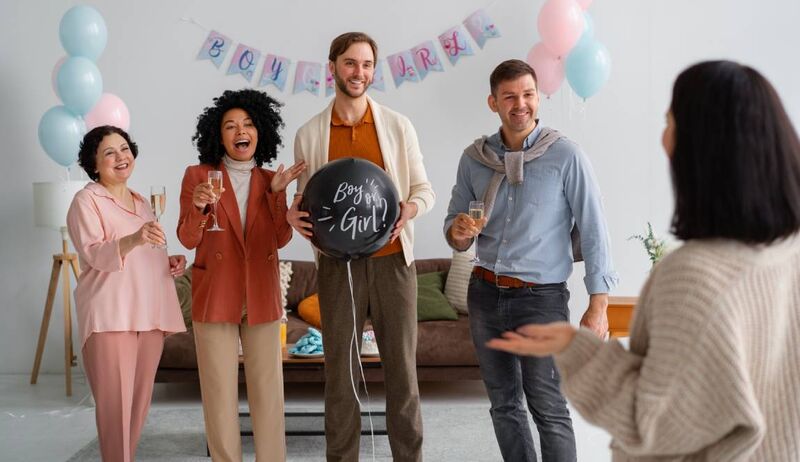 Festa de revelação de gênero com quatro pessoas felizes